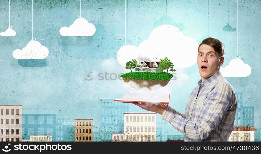 Man reading red book. Young student guy with opened book in hands and green life concept