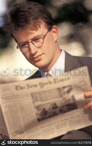 Man Reading the New York Times
