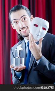 Man receiving award in mask