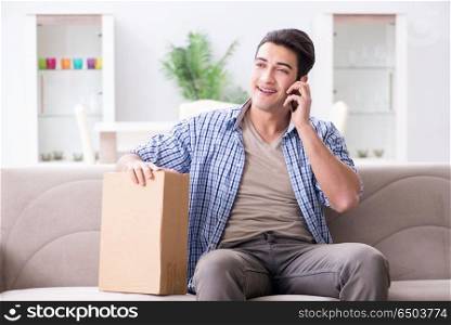 Man receiving parcel at home