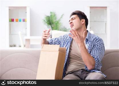 Man receiving wrong parcel with glasses