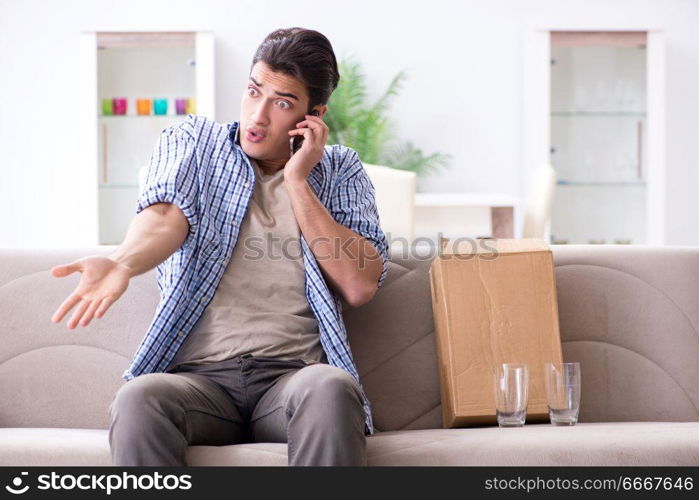 Man receiving wrong parcel with glasses