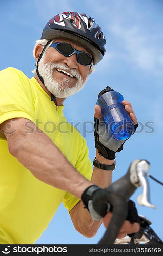 Man Refreshing After a Bicycle Ride