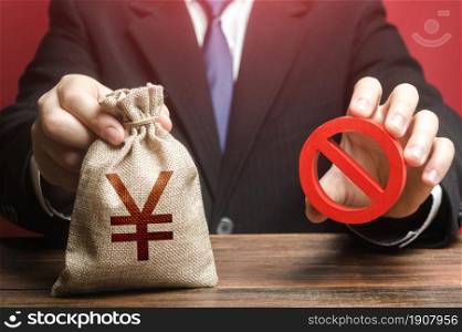 Man refuses to give out chinese yuan or japanese yen money bag. Refusal to provide a loan, bad credit history. Financial difficulties. Asset freeze seizure. Economic sanctions, confiscation of funds.