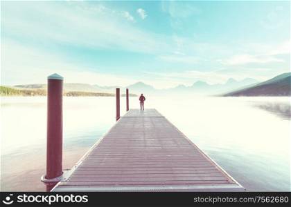 Man relaxing at beautiful mountains lake.