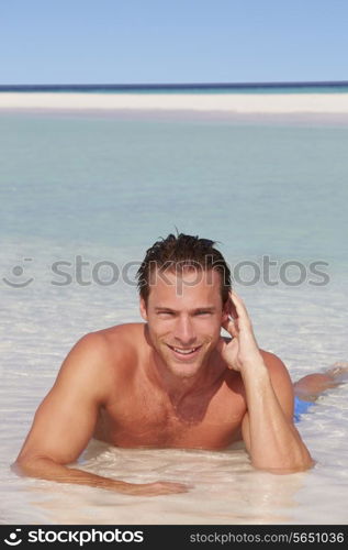 Man Relaxing In Sea On Beach Tropical Beach