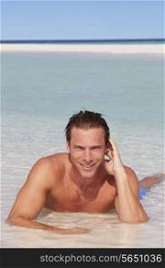 Man Relaxing In Sea On Beach Tropical Beach