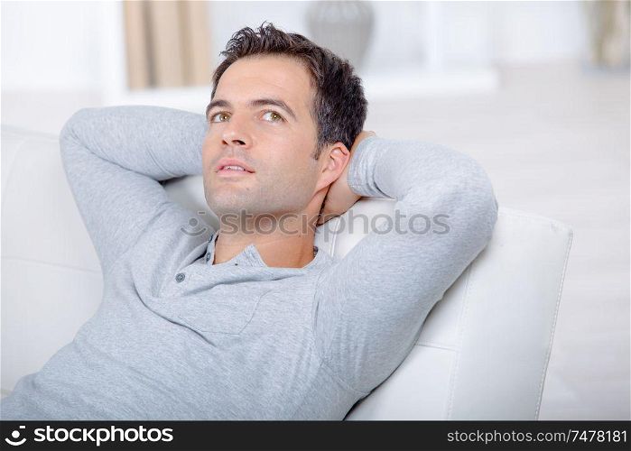 Man relaxing on his sofa