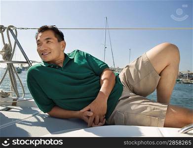 Man Relaxing on Sailboat