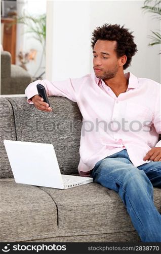 man relaxing on the sofa