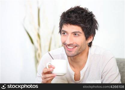 Man relaxing with a hot drink