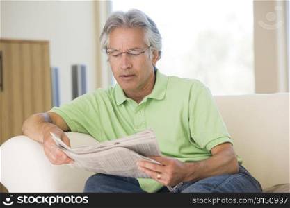 Man relaxing with a newspaper
