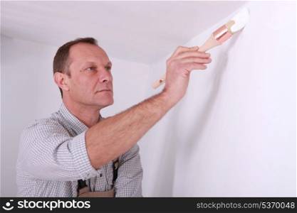Man repainting home walls