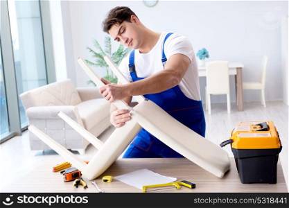 Man repairing chair in the room