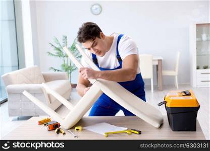 Man repairing chair in the room