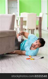 Man repairing furniture at home