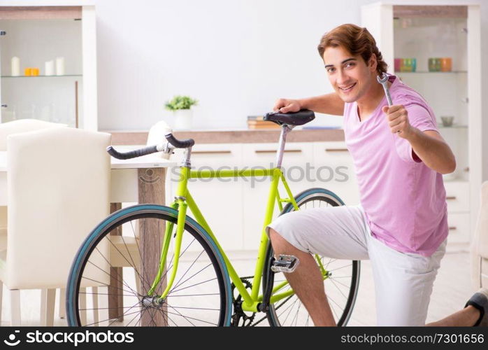 Man repairing his broken bicycle