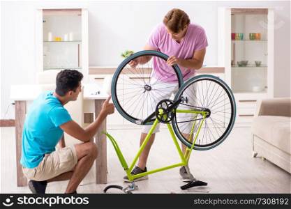 Man repairing his broken bicycle