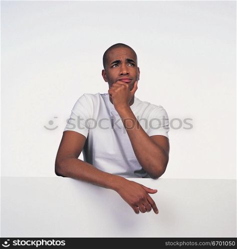 man resting on top of wall