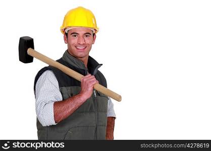 Man resting sledge-hammer on shoulder