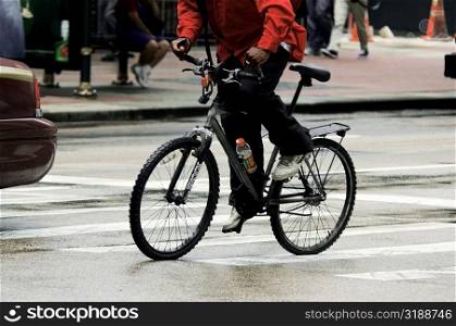 Man riding a bicycle, Chicago, Illinois, USA