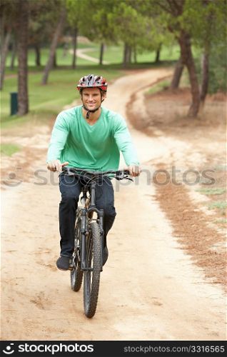 Man riding bicycle in park
