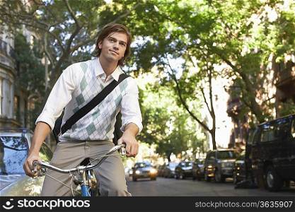 Man riding bicycle in residential district