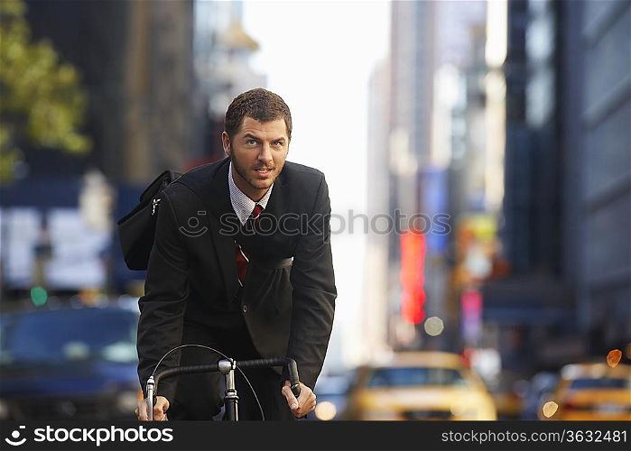 Man riding bicycle on street