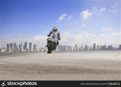 man riding big motorcycle on asphalt highway against urban skyline background