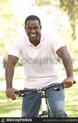 Man Riding Bike In Park
