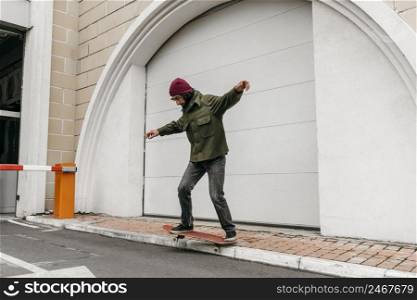 man riding his skateboard outdoors city