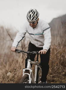 man riding mountain bike alone