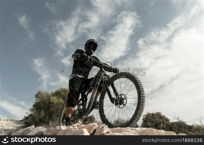 man riding mountain bike low angle. Resolution and high quality beautiful photo. man riding mountain bike low angle. High quality beautiful photo concept