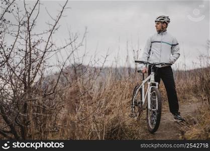 man riding mountain bike special equipment with copy space 2