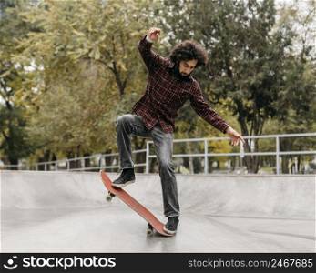 man riding skateboard park