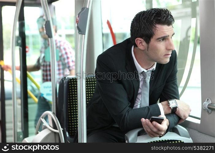Man riding tram to work