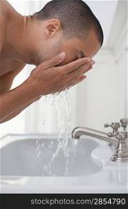 Man Rinsing His Face
