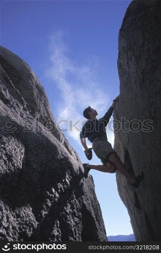 Man Rock Climbing