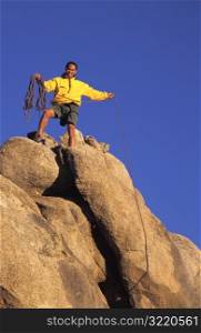 Man Rock Climbing