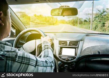 Man&rsquo;s hands on the wheel of the car, a person driving with hands on the wheel, inside view of a man driving a car, Concept of hands on the wheel of a car