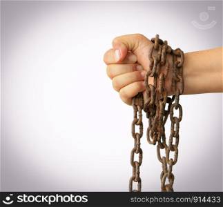 Man's hands tied with chains isolated on white background