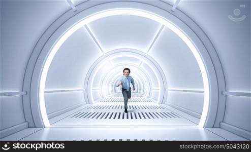 Man run in virtual room mixed media. Young businessman running in futuristic 3D tunnel