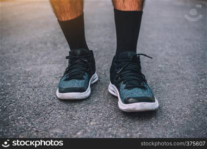 Man run on the street be running for exercise,Run sports background and closeup at running shoe