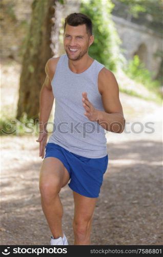 man running jogging outdoors in park