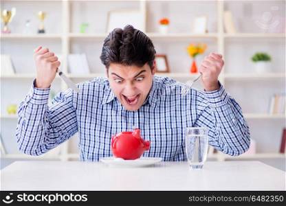 Man running out of money in restaurant and using savings from pi. Man running out of money in restaurant and using savings from piggy bank. Man running out of money in restaurant and using savings from pi