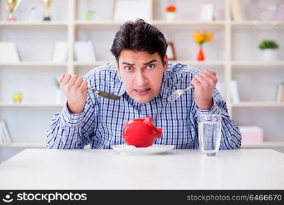 Man running out of money in restaurant and using savings from piggy bank. Man running out of money in restaurant and using savings from pi