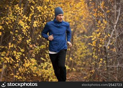 man running trail forest