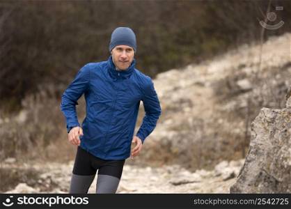 man running trail nature