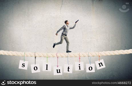 Man running with book. Funny student guy running on rope with opened book in hand