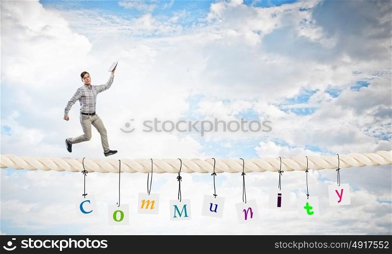 Man running with book. Funny student guy running on rope with opened book in hand